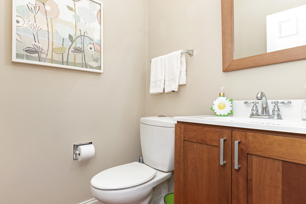 2935 Gypsum Circle Naperville, IL 60564 - Photo 27 of 34 a bathroom with a toilet sink and mirror