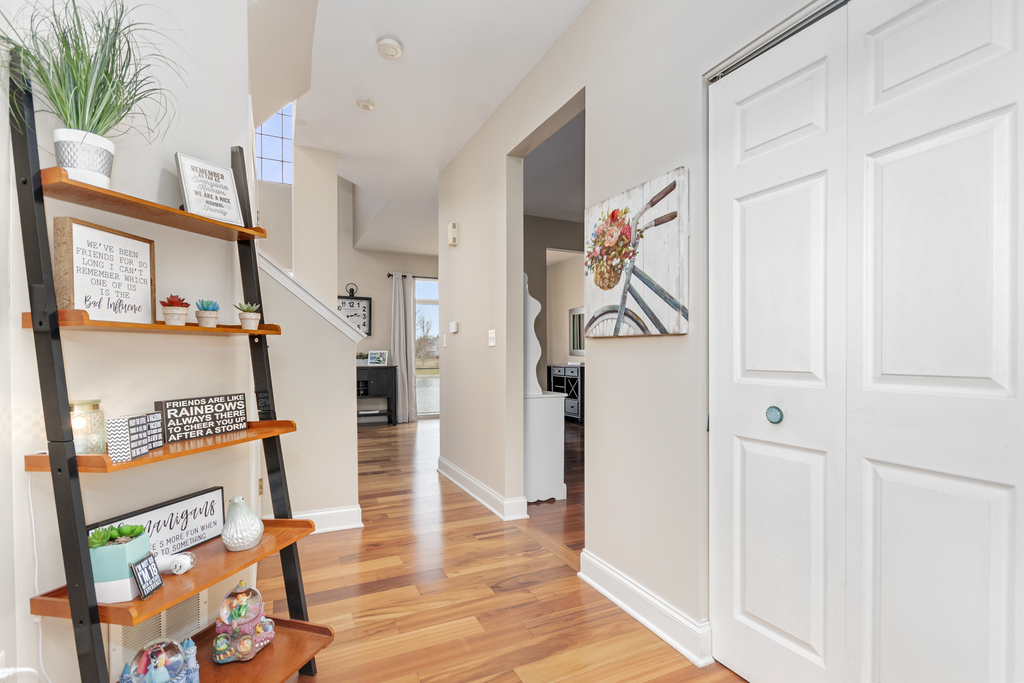 2935 Gypsum Circle Naperville, IL 60564 - Photo 4 of 34 a view of a hallway with wooden floor and entryway