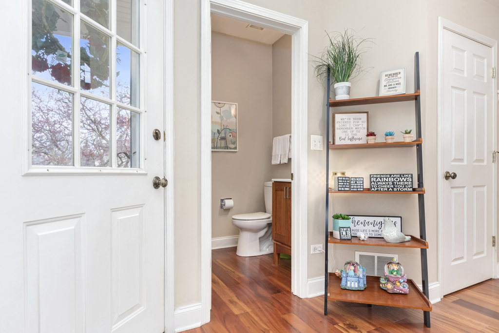 2935 Gypsum Circle Naperville, IL 60564 - Photo 5 of 34 a bathroom with a toilet and a painting on the wall