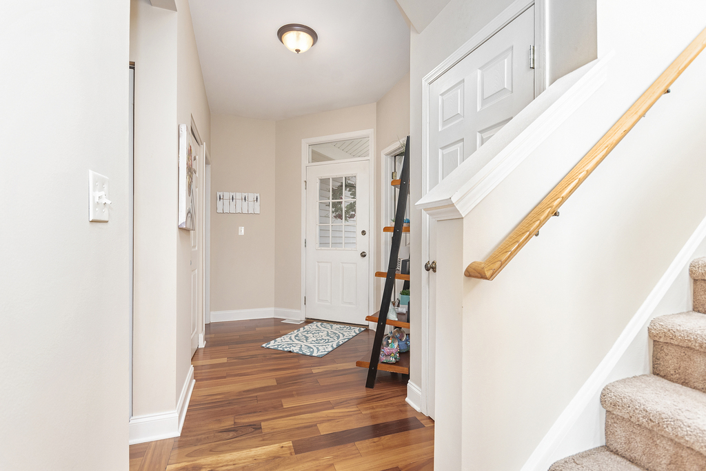 2935 Gypsum Circle Naperville, IL 60564 - Photo 6 of 34 a view of a hallway with wooden floor and entryway
