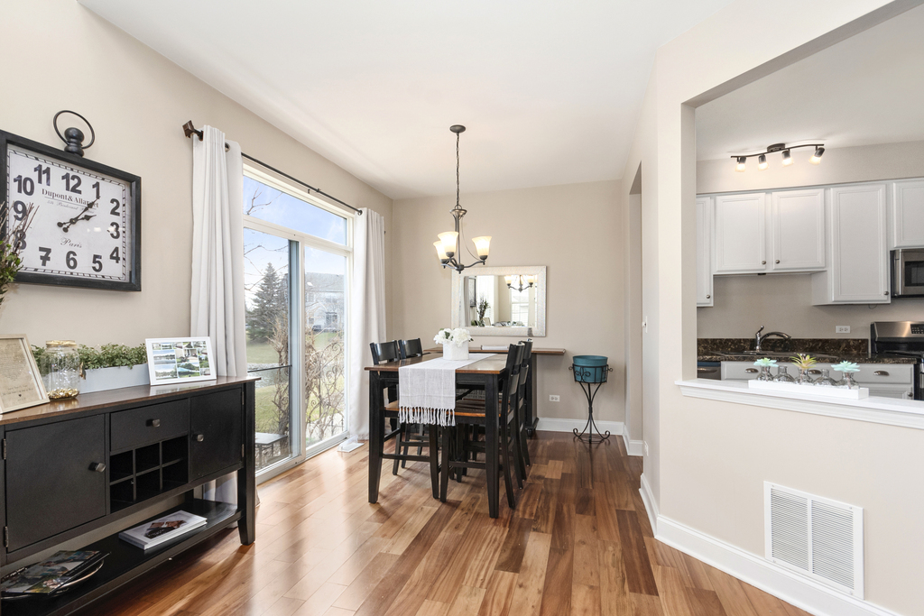 2935 Gypsum Circle Naperville, IL 60564 - Photo 10 of 34 a view of a dining room with furniture window and wooden floor