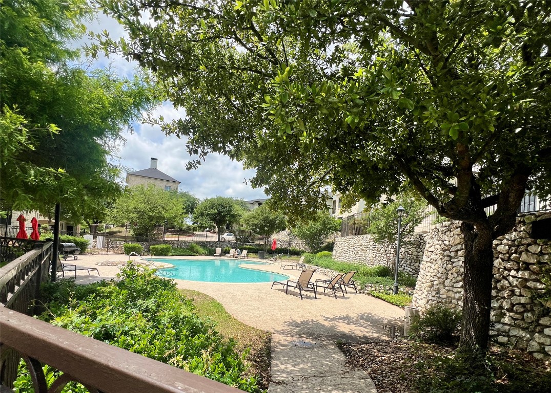 7701 Rialto Boulevard, Unit 1328 Austin, TX 78735 - Photo 17 of 17 Community pool featuring a patio