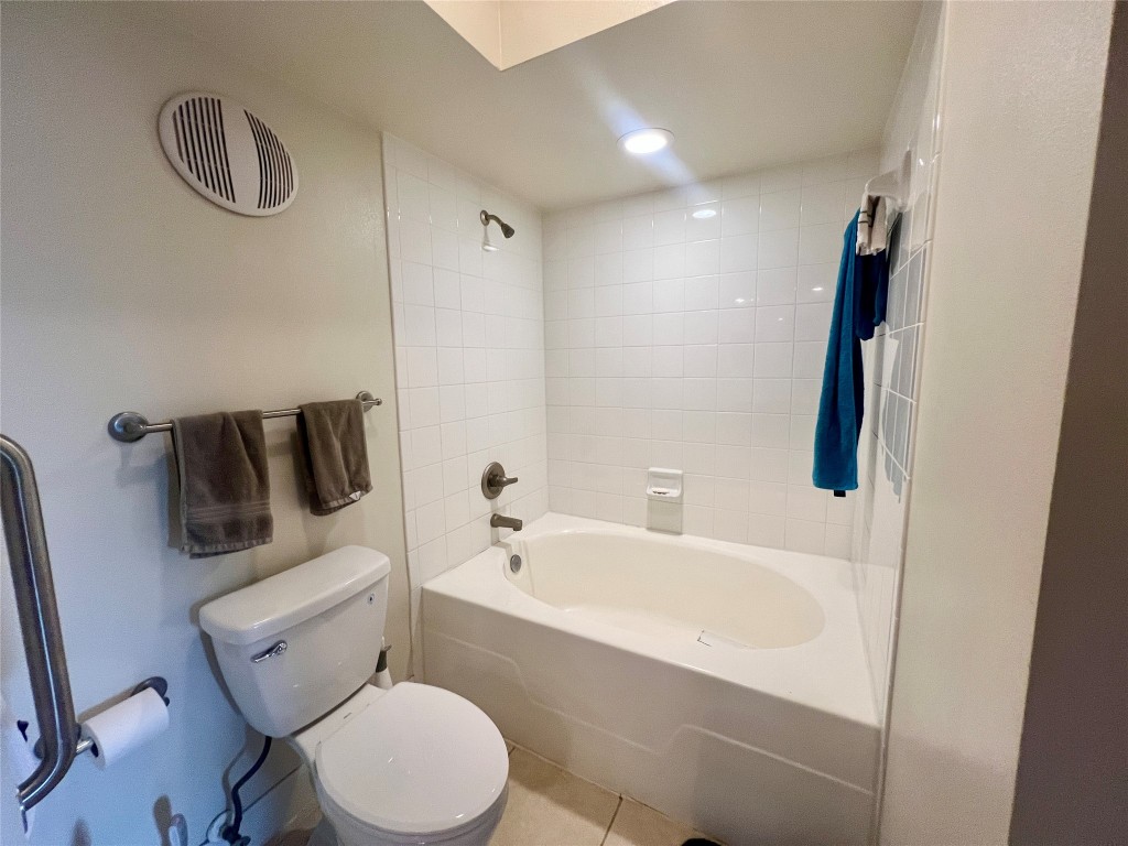 7701 Rialto Boulevard, Unit 1328 Austin, TX 78735 - Photo 4 of 17 Bathroom with shower / washtub combination, tile patterned floors, and recessed lighting