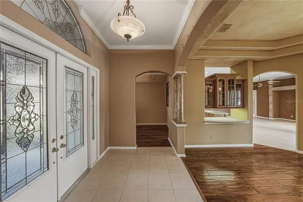 a large kitchen with stainless steel appliances a refrigerator and a stove