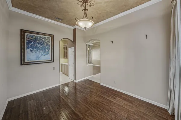 a kitchen with stainless steel appliances granite countertop a sink and a refrigerator
