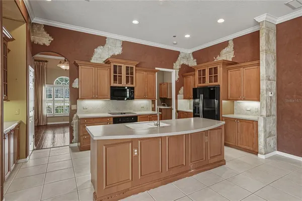 a large bathroom with a large tub and sink