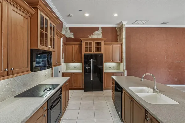 a spacious bathroom with a granite countertop sink a mirror and a bathtub
