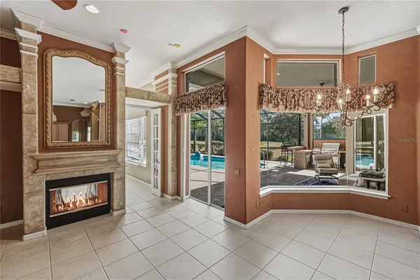 a view of a bedroom with furniture window and front door