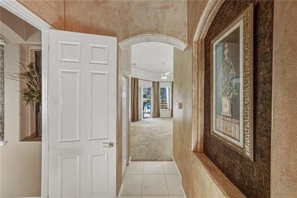 a view of a livingroom with an empty space and a window