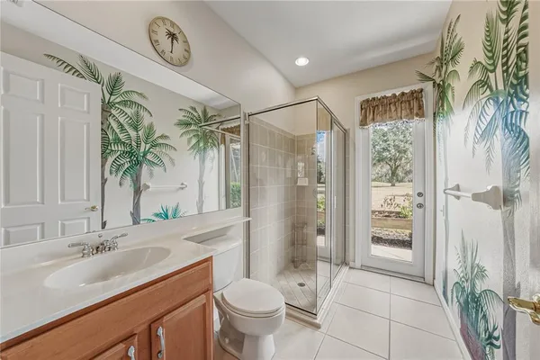 an aerial view of a residential houses with outdoor space and street view