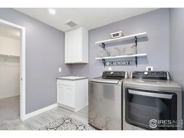 a kitchen with a stove top oven and cabinets