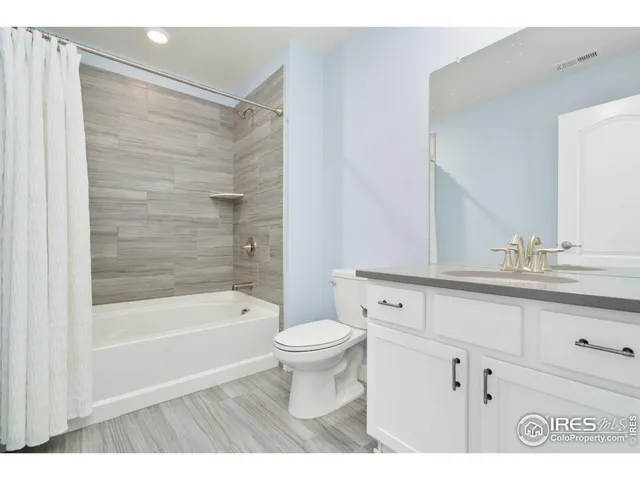 a bathroom with a sink a toilet and a bathtub