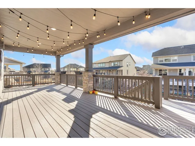a view of a balcony with wooden floor