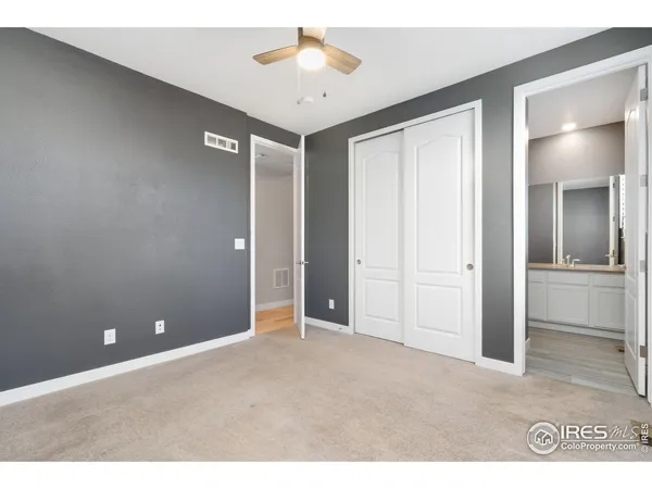 a view of a livingroom with a chandelier fan