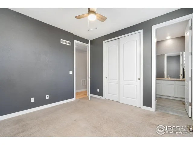 a view of a livingroom with a chandelier fan