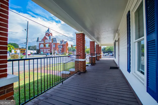 a front view of a house with a large window