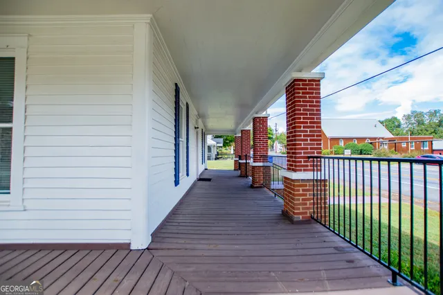 a front view of house with yard and outdoor seating
