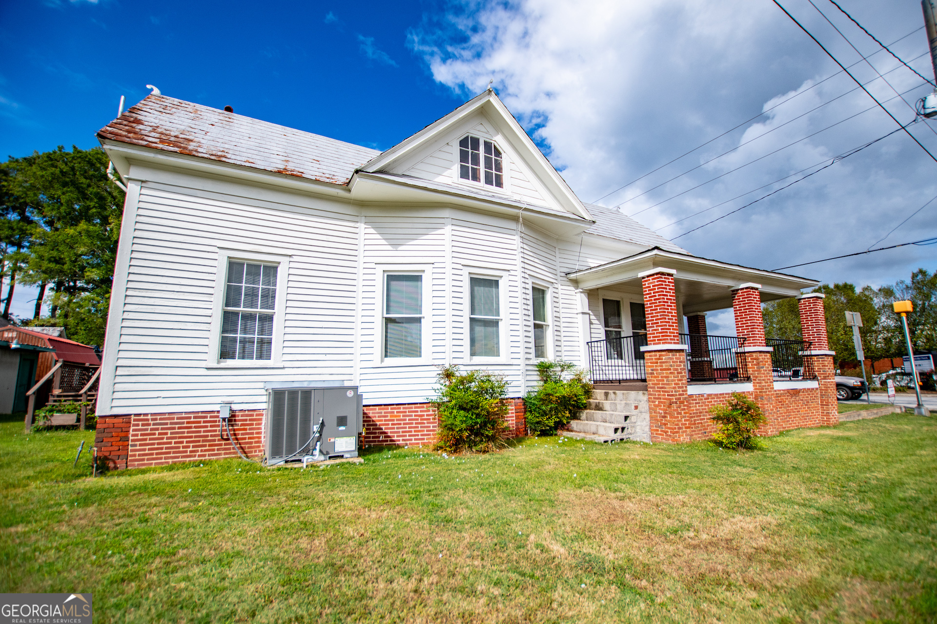 3608 Us Highway Buchanan, GA 30113 - Photo 34 of 92 a front view of house with yard and outdoor seating