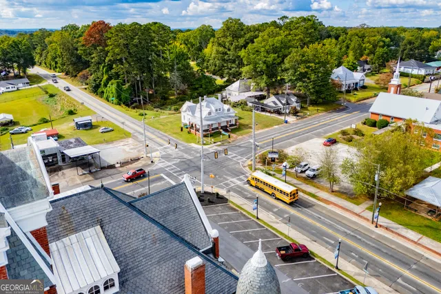 a view of swimming pool with sitting area
