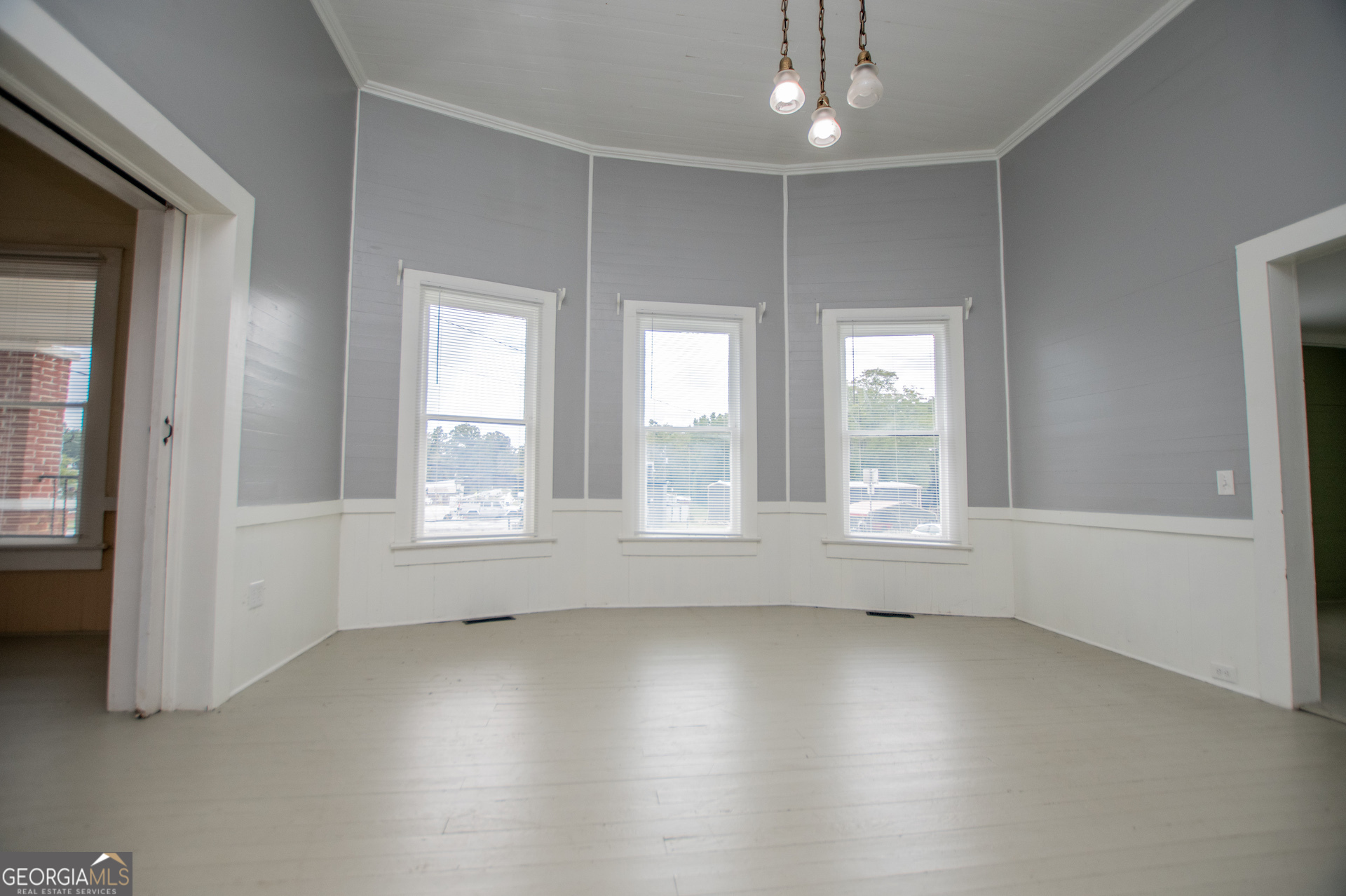 3608 Us Highway Buchanan, GA 30113 - Photo 47 of 92 an empty room with wooden floor and windows