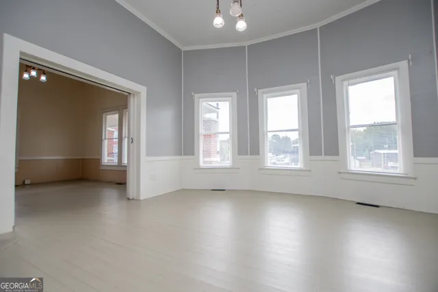 an aerial view of a house with swimming pool garden and patio