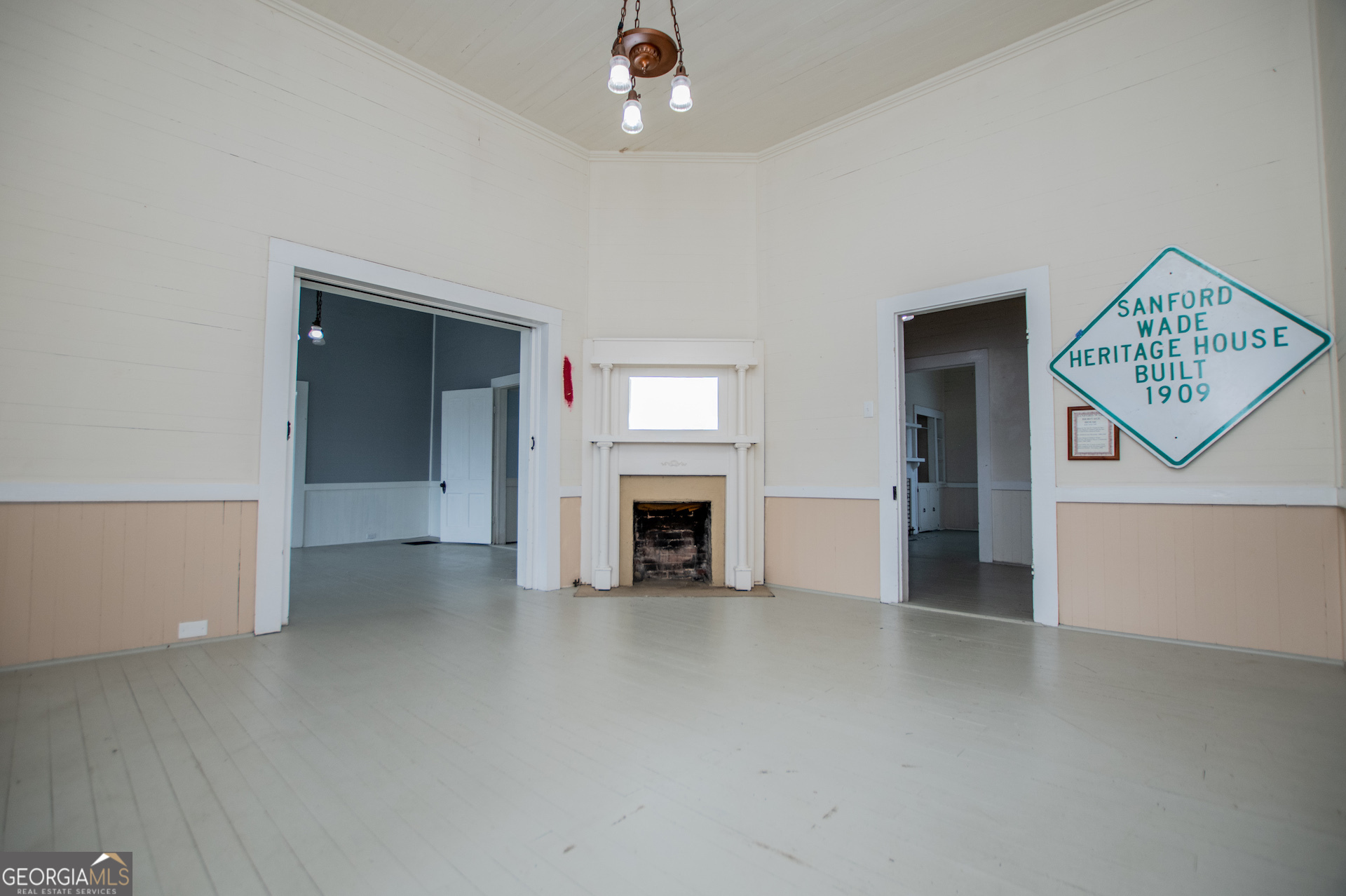 3608 Us Highway Buchanan, GA 30113 - Photo 55 of 92 an empty room with a fireplace and painted walls