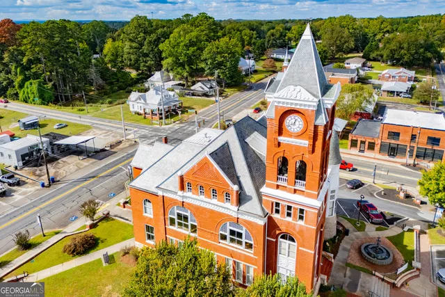a aerial view of a house with a swimming pool