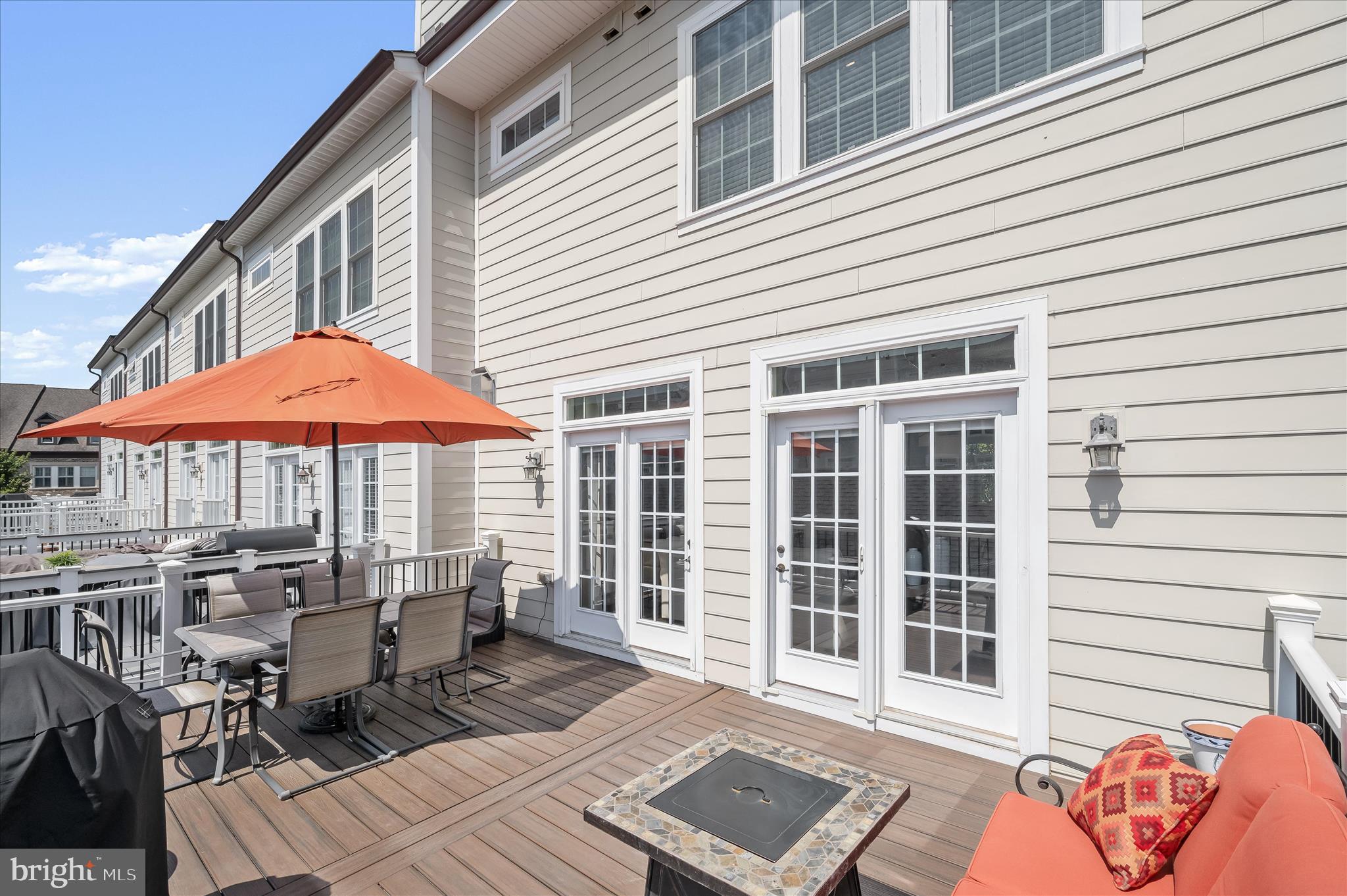 11285 Terrace Lane Fulton, MD 20759 - Photo 25 of 52 a patio with a table and chairs under an umbrella