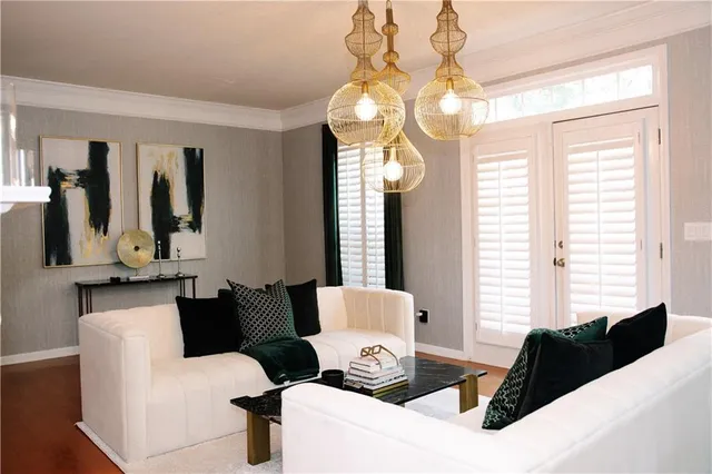 a living room with furniture and a large mirror