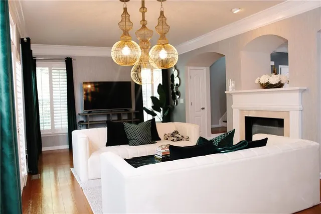 a living room with fireplace furniture and a flat screen tv