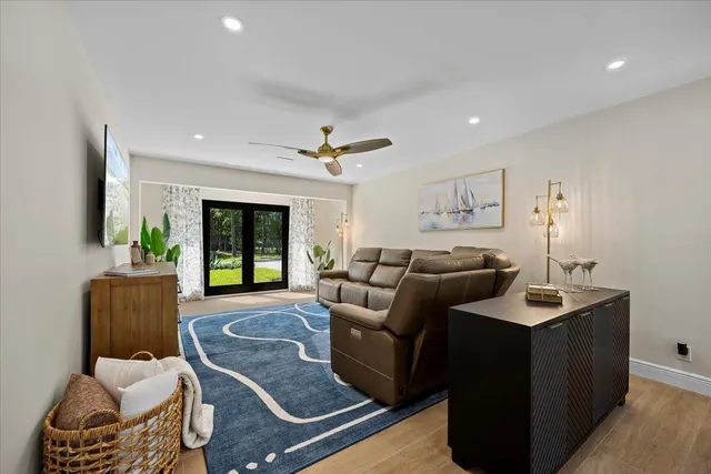 a kitchen with a stove sink and wooden cabinets