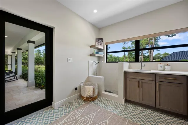 a kitchen with a sink stove and cabinets