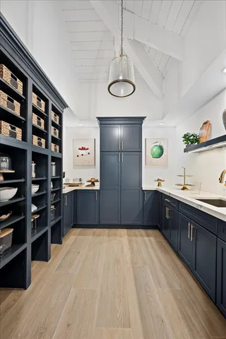a kitchen with stainless steel appliances a sink stove and refrigerator