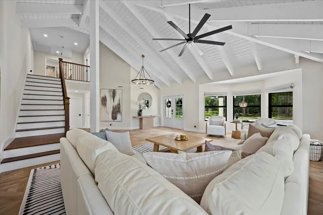 a kitchen with stainless steel appliances granite countertop a sink and wooden cabinets