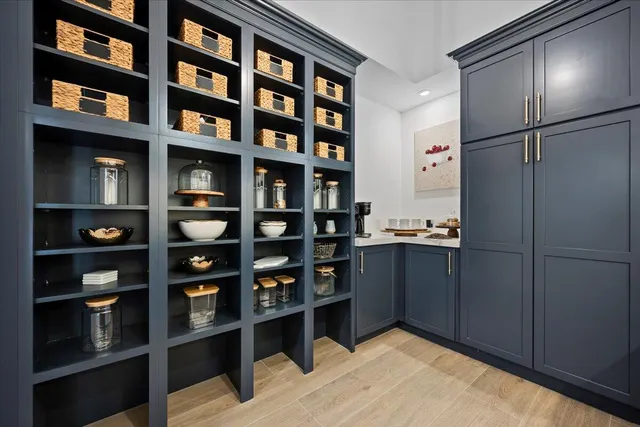 a view of workspace with wooden floor and windows