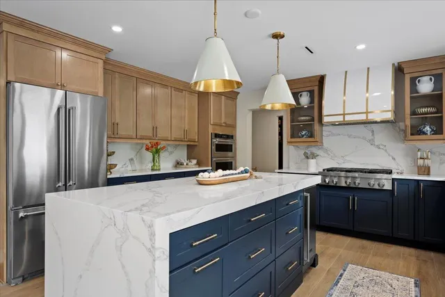 a view of a bedroom with a bed and wooden floor