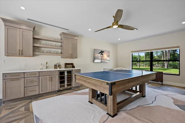 a kitchen with kitchen island stainless steel appliances a sink and counter space