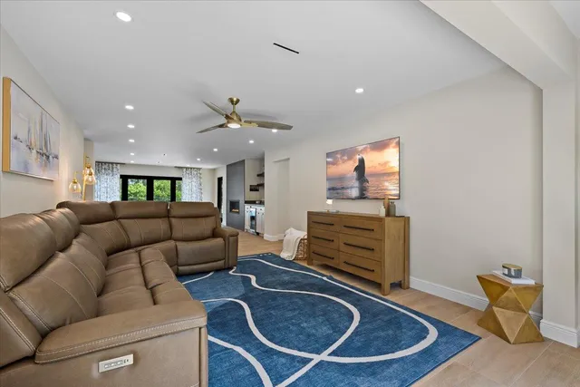 a spacious bedroom with a large bed and a couch