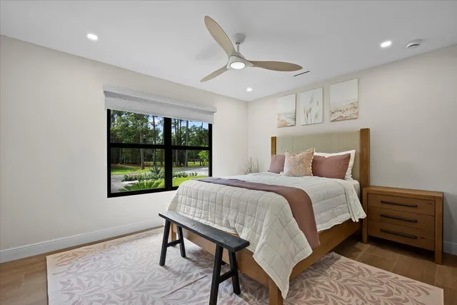 a bathroom with a granite countertop sink a toilet and a shower