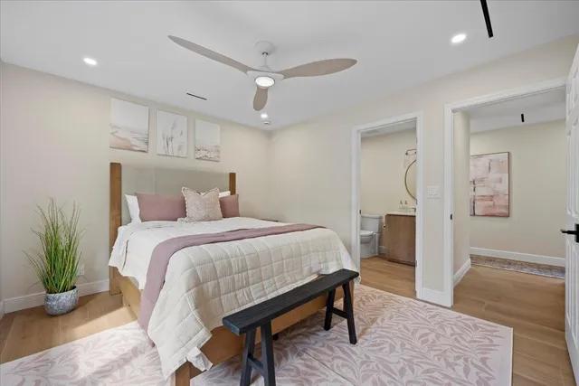 a bedroom with a bed and a view of bedroom