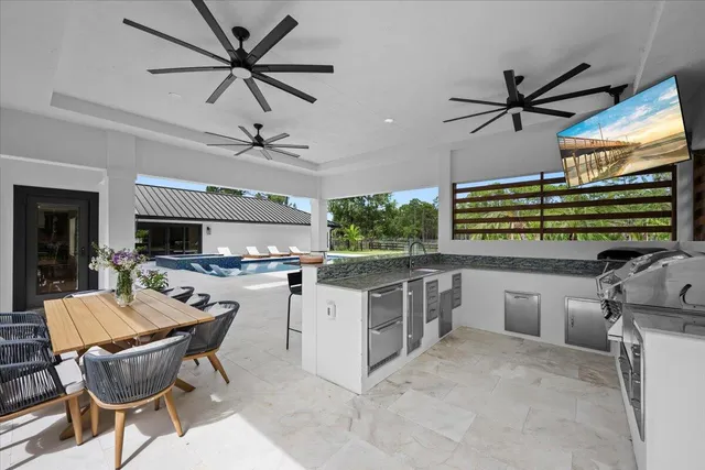 an aerial view of residential houses with outdoor space and street view