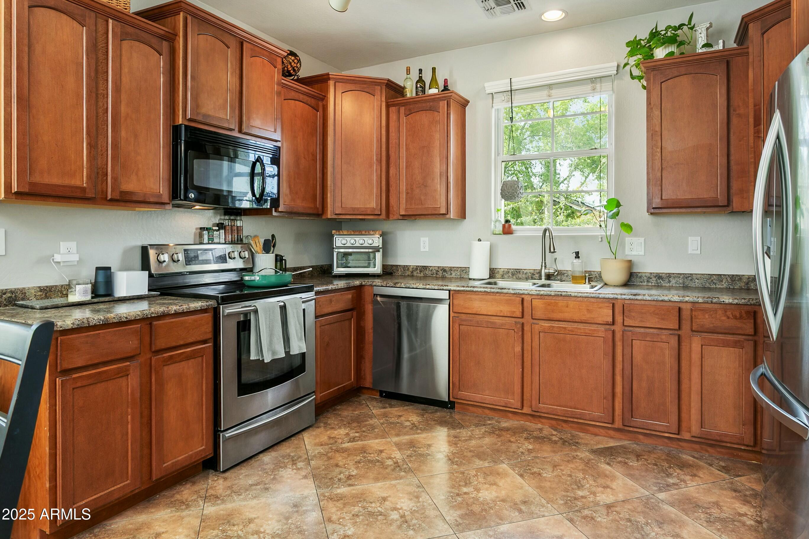 4136 East Tyson Street Gilbert, AZ 85295 - Photo 6 of 24 Staggered Warm Cabinetry
