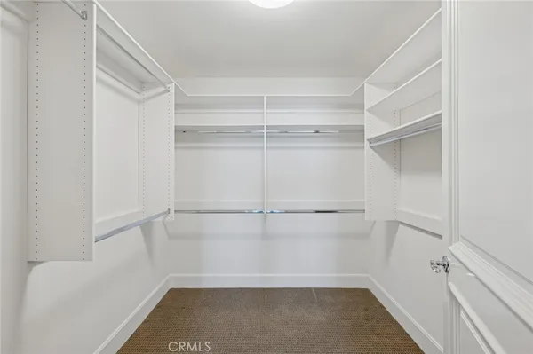 a view of an empty walk in closet