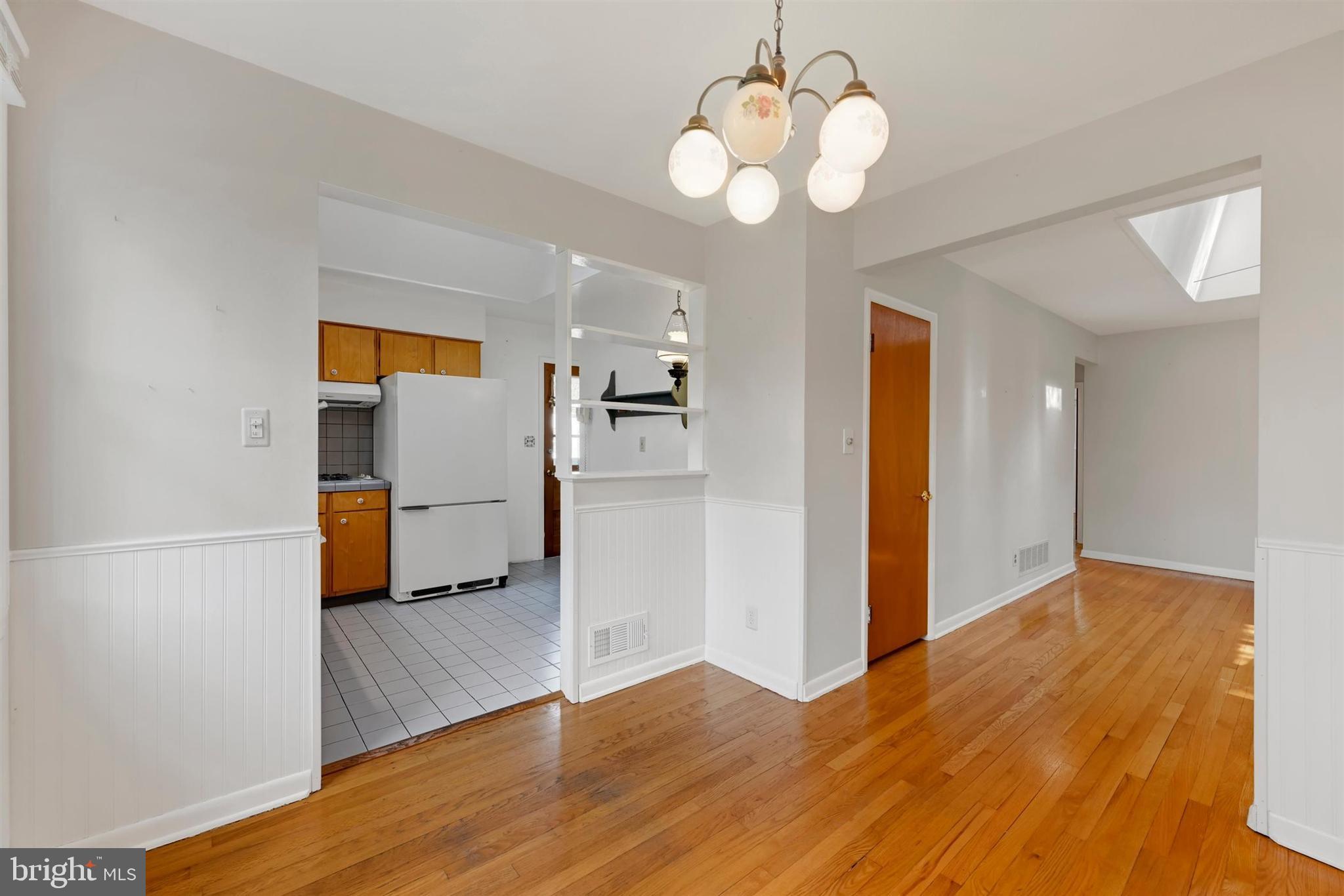 2926 Knoll Acres Drive Baltimore, MD 21234 - Photo 11 of 49 wooden floor in an empty room with a window