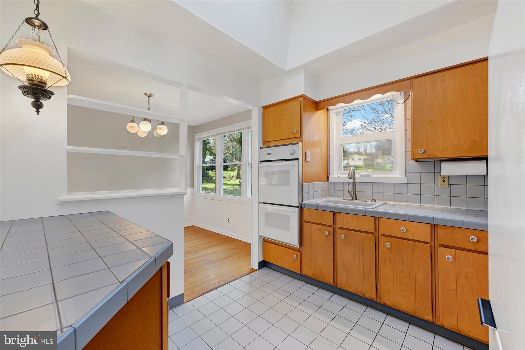 2926 Knoll Acres Drive Baltimore, MD 21234 - Photo 13 of 49 a kitchen with stainless steel appliances granite countertop a sink and cabinets