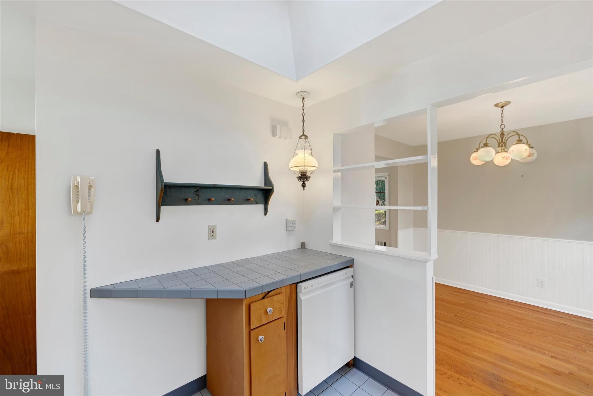 2926 Knoll Acres Drive Baltimore, MD 21234 - Photo 14 of 49 a view of cabinets and wooden floor