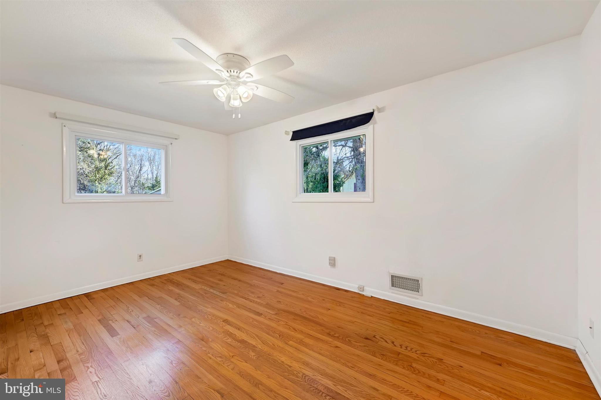 2926 Knoll Acres Drive Baltimore, MD 21234 - Photo 16 of 49 a view of empty room with wooden floor