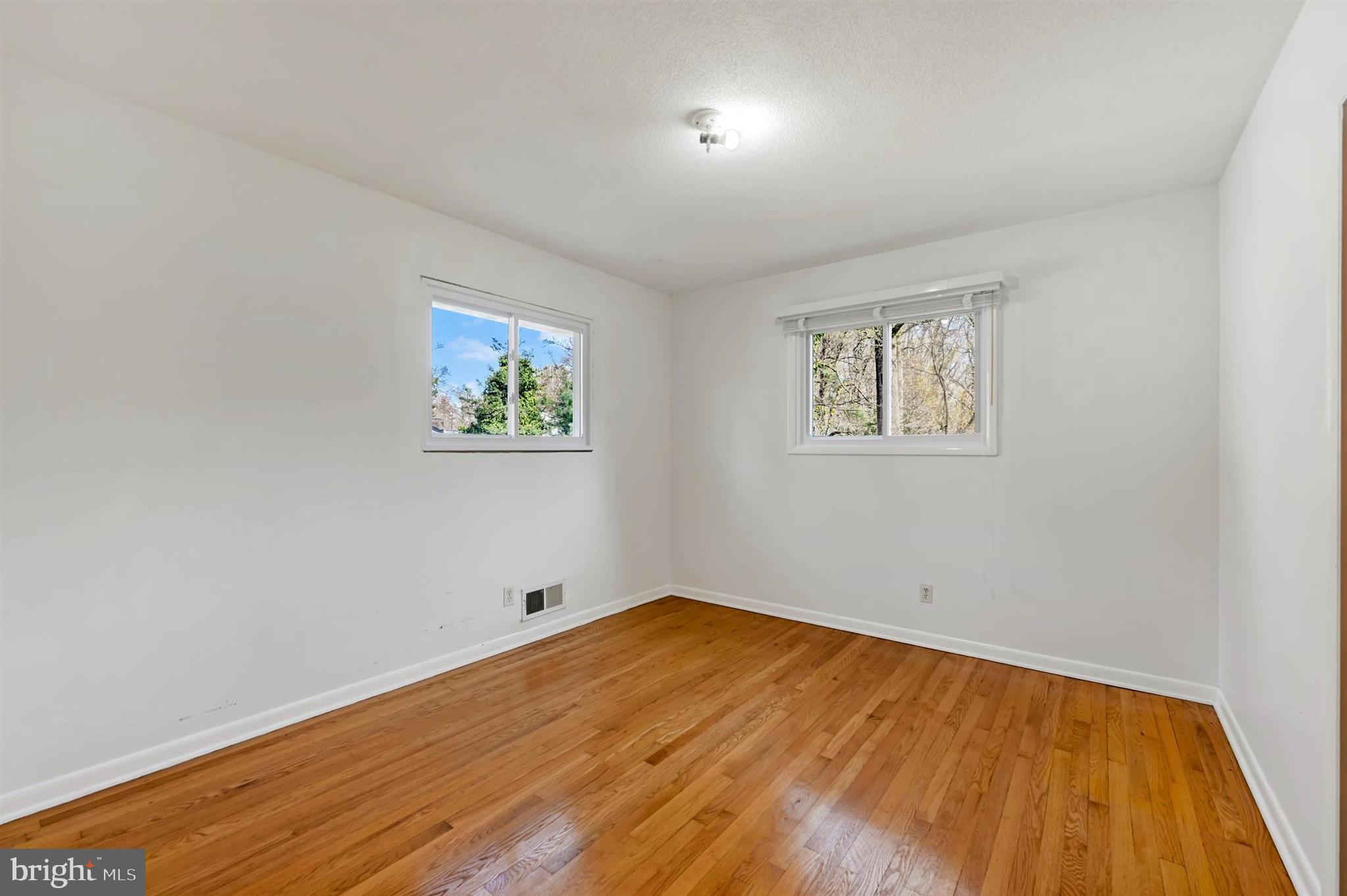 2926 Knoll Acres Drive Baltimore, MD 21234 - Photo 18 of 49 a view of empty room with wooden floor
