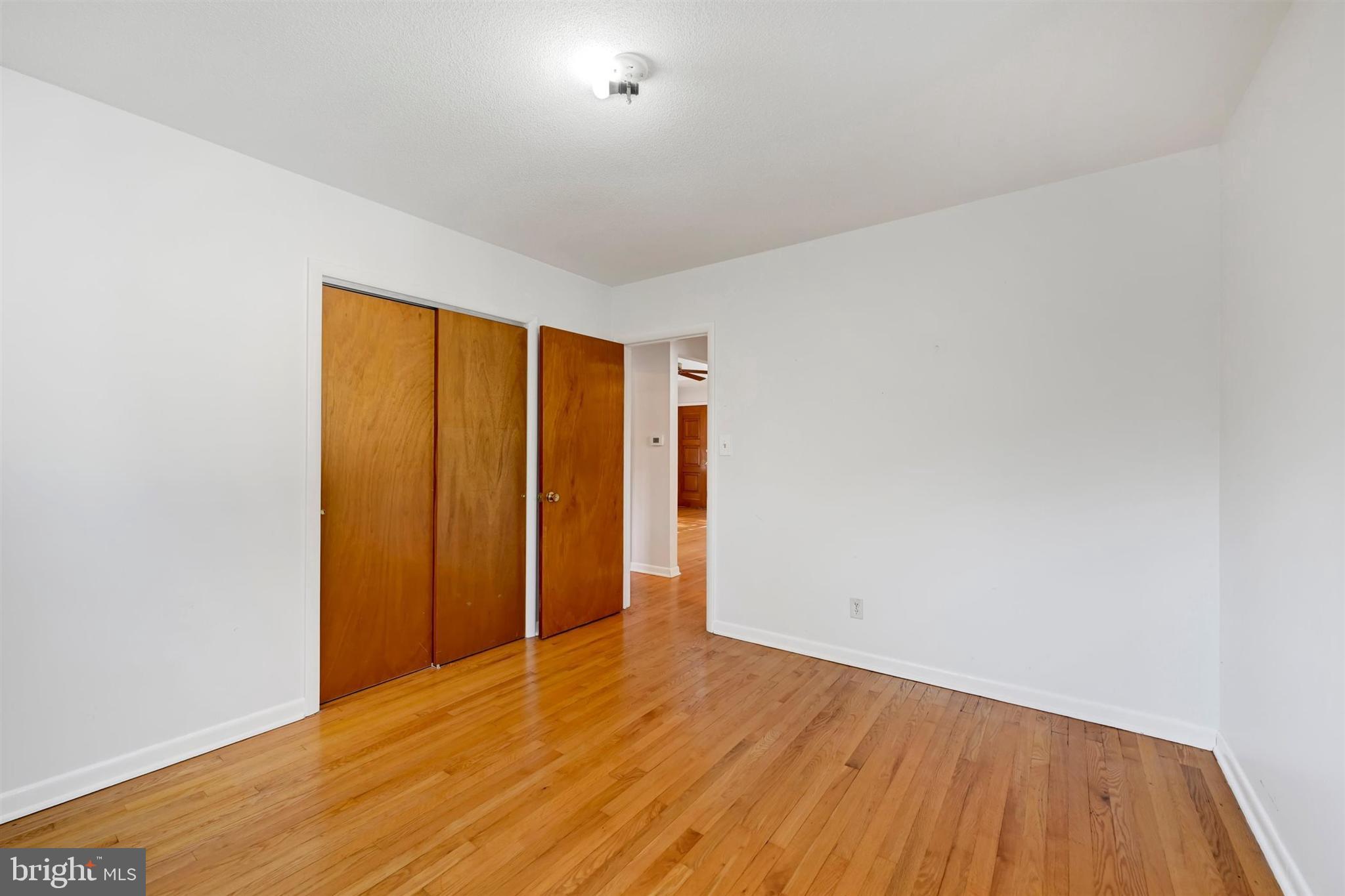 2926 Knoll Acres Drive Baltimore, MD 21234 - Photo 19 of 49 a view of an empty room with wooden floor
