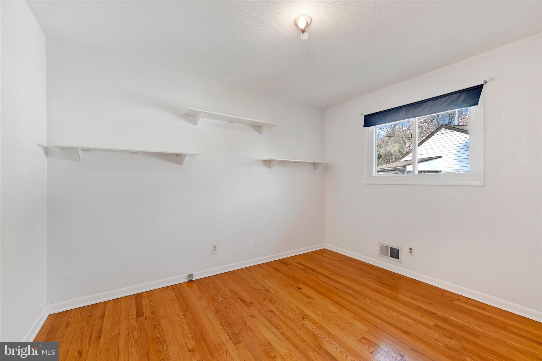 2926 Knoll Acres Drive Baltimore, MD 21234 - Photo 20 of 49 a view of empty room with wooden floor